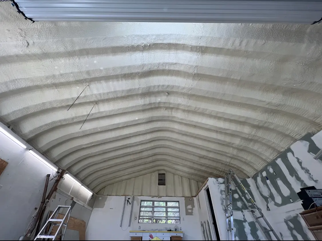 Spray polyurethane foam applied to the underside of a metal roof deck in Tooele